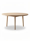 **Ronde houten tafel met drie poten**